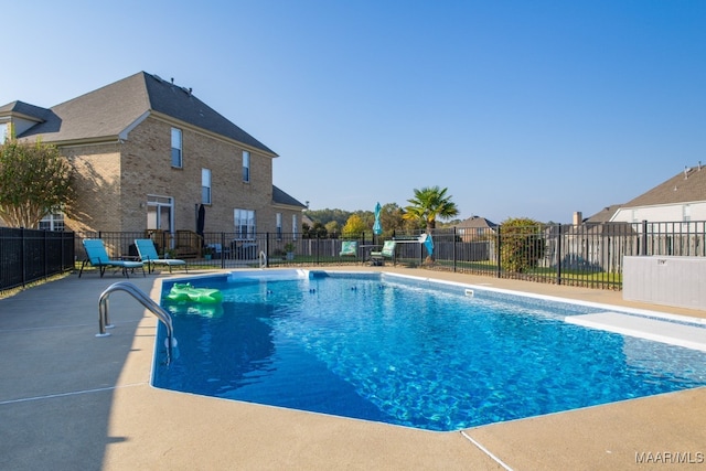 view of swimming pool featuring a patio area