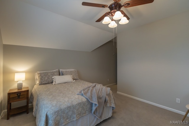 carpeted bedroom featuring ceiling fan and vaulted ceiling