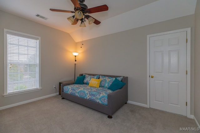 bedroom featuring multiple windows, ceiling fan, light colored carpet, and vaulted ceiling