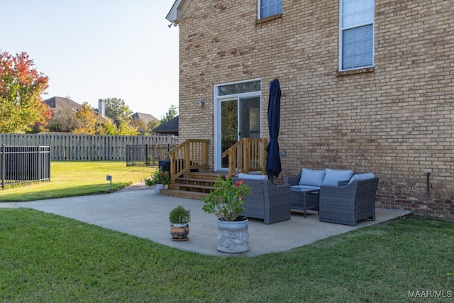 rear view of property with outdoor lounge area, a yard, and a patio