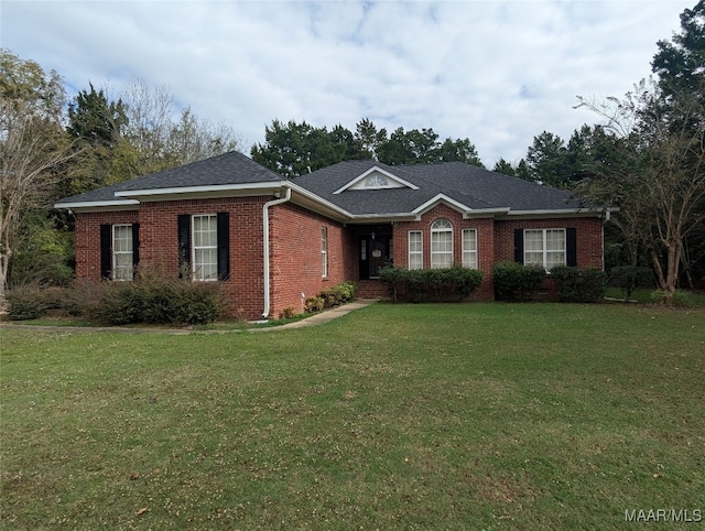 single story home featuring a front yard