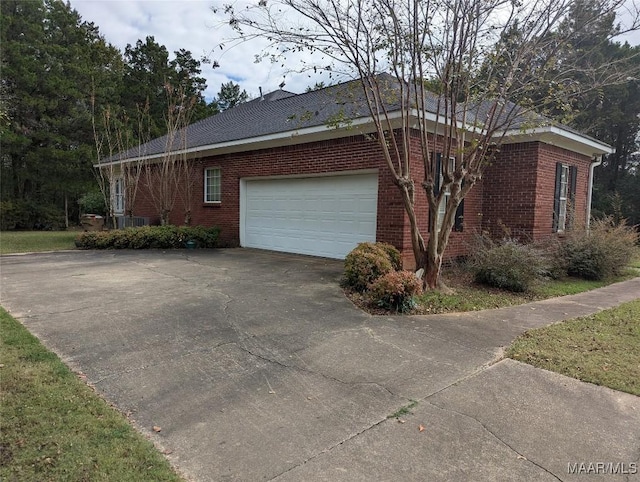 106 Crown Ridge Dr, Selma, AL 36701 - view of home's exterior featuring driveway, brick siding, and a garage