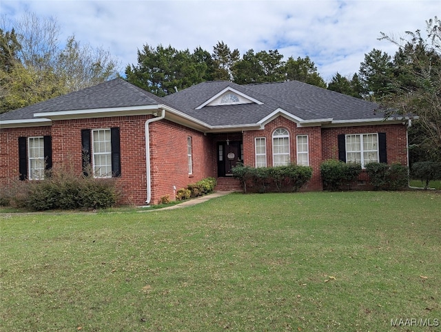 ranch-style home featuring a front lawn