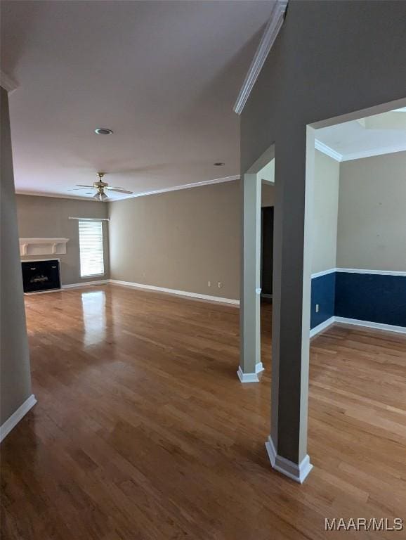 106 Crown Ridge Dr, Selma, AL 36701 - unfurnished living room featuring crown molding, ceiling fan, wood finished floors, baseboards, and a fireplace
