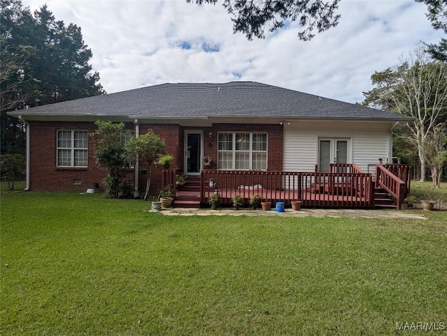 106 Crown Ridge Dr, Selma, AL 36701 - rear view of house featuring a wooden deck, a lawn, a shingled roof, and brick siding
