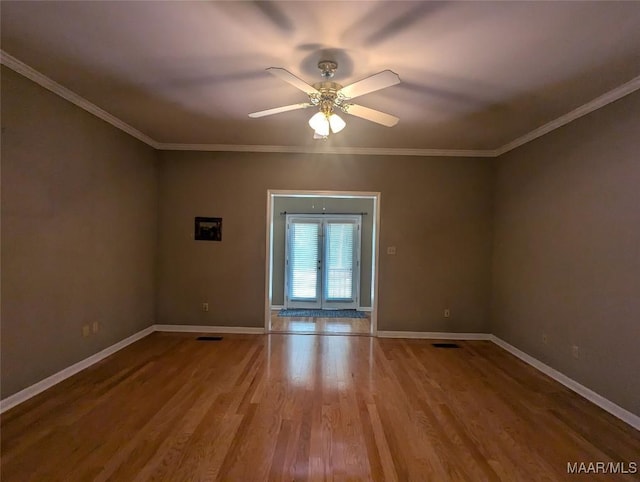 106 Crown Ridge Dr, Selma, AL 36701 - unfurnished room featuring wood finished floors, baseboards, ceiling fan, and ornamental molding