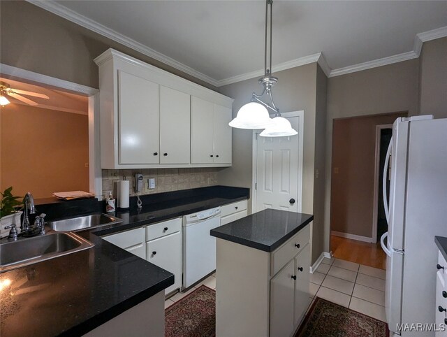 kitchen with white appliances, white cabinetry, and ornamental molding