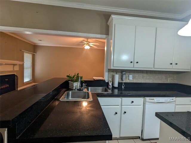 106 Crown Ridge Dr, Selma, AL 36701 - kitchen featuring white dishwasher, dark countertops, ornamental molding, decorative backsplash, and white cabinetry