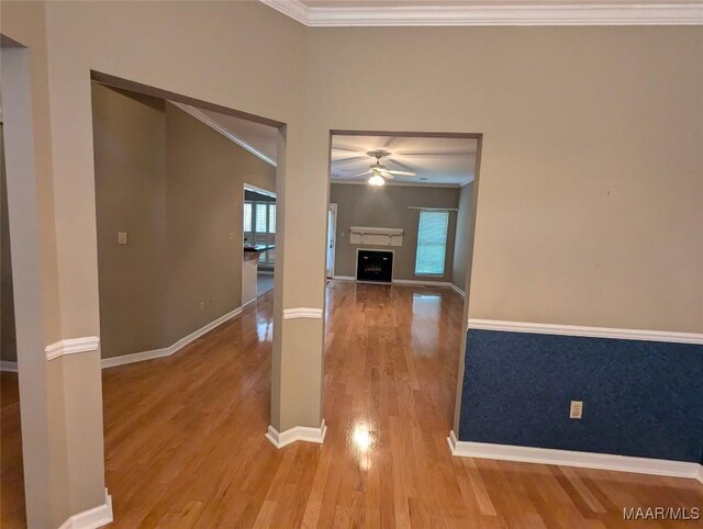 106 Crown Ridge Dr, Selma, AL 36701 - unfurnished living room featuring a ceiling fan, ornamental molding, wood finished floors, a fireplace, and baseboards