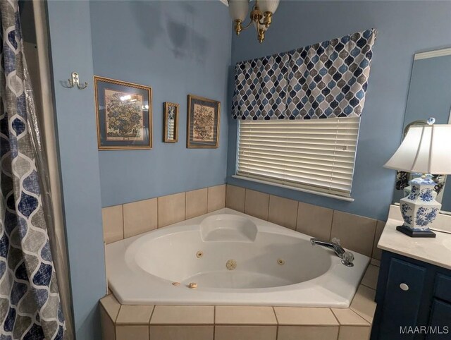 106 Crown Ridge Dr, Selma, AL 36701 - bathroom with a jetted tub, vanity, and a chandelier