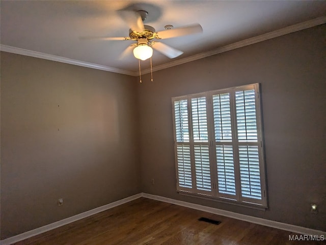 spare room featuring hardwood / wood-style floors, ceiling fan, and ornamental molding