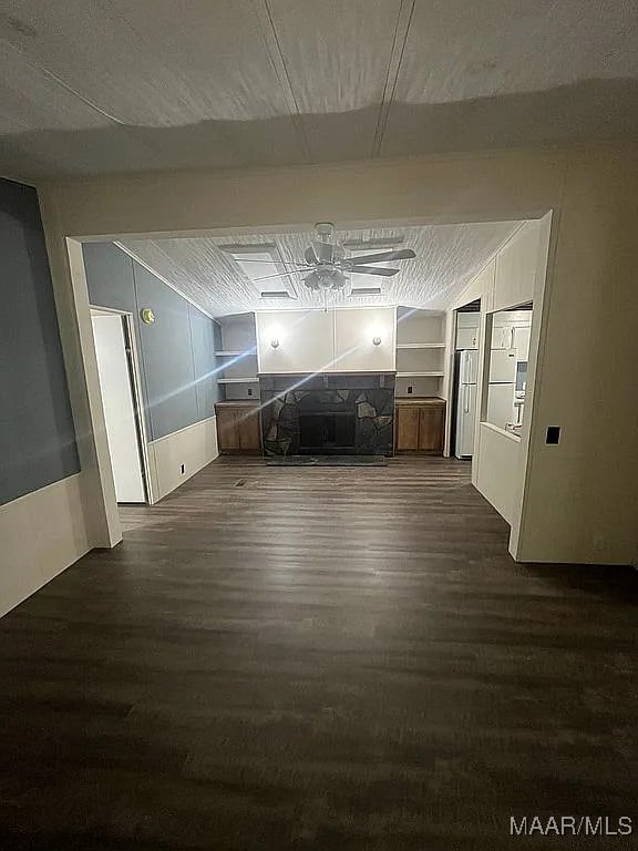 corridor with built in features and dark wood-type flooring