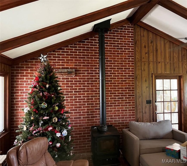 10521 US Highway 31, Hope Hull, AL 36043 - living area with a wood stove, plenty of natural light, brick wall, and wooden walls