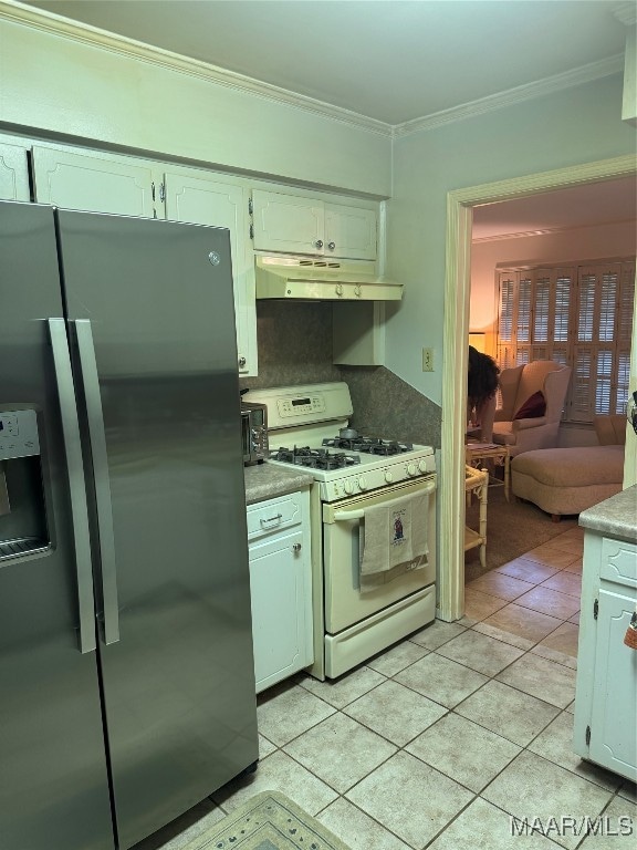 kitchen featuring backsplash, white cabinets, stainless steel refrigerator with ice dispenser, light tile patterned floors, and white range with gas stovetop