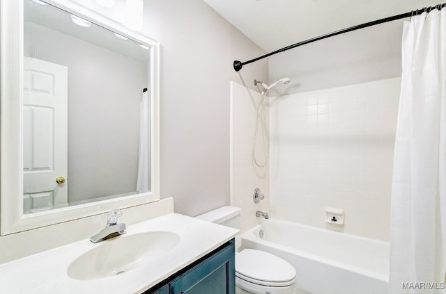 bathroom featuring toilet, shower / tub combo, and vanity