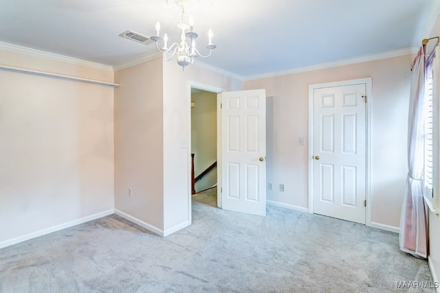 unfurnished bedroom featuring baseboards, visible vents, crown molding, carpet flooring, and a chandelier