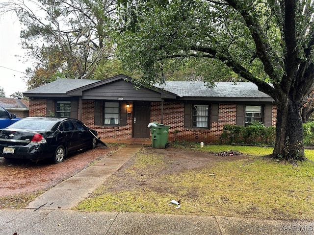 ranch-style house with a front yard