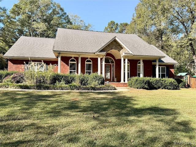 view of front of property with a porch and a front lawn