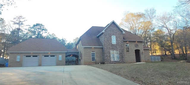 view of front of property with a garage and a front lawn