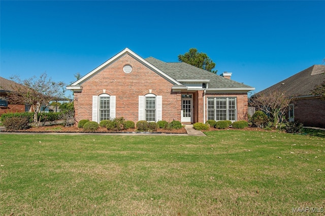 view of property featuring a front lawn