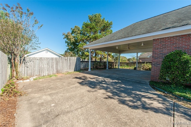 exterior space with ceiling fan