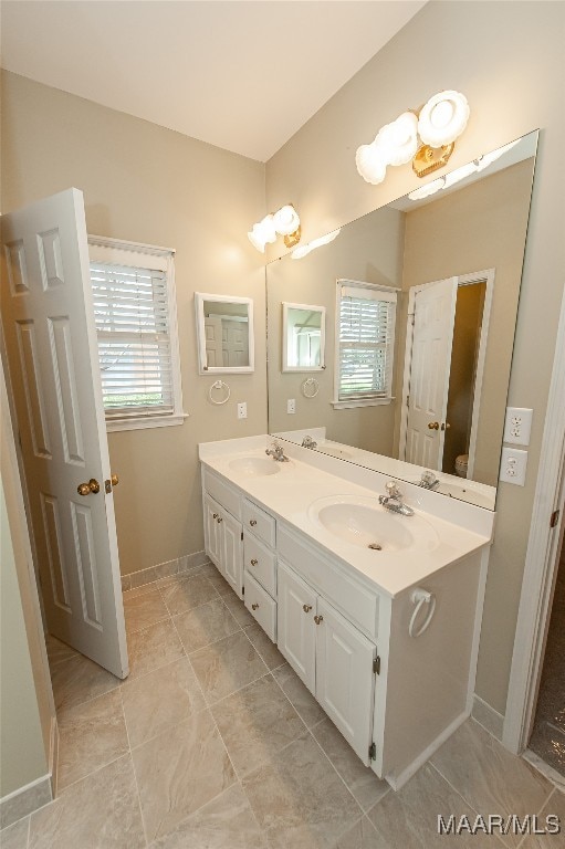 bathroom with vanity and a wealth of natural light