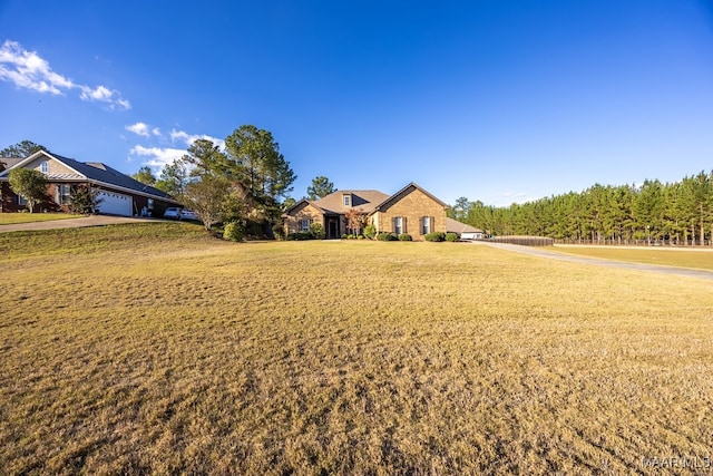 ranch-style home with a front lawn