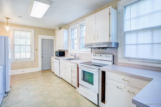 kitchen with sink, backsplash, decorative light fixtures, white appliances, and white cabinets