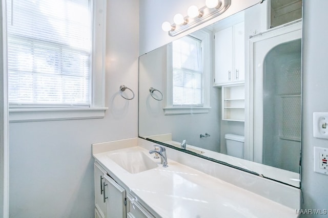 bathroom with vanity and toilet