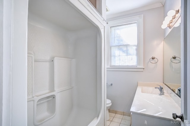 bathroom with tile patterned flooring, vanity, toilet, and crown molding