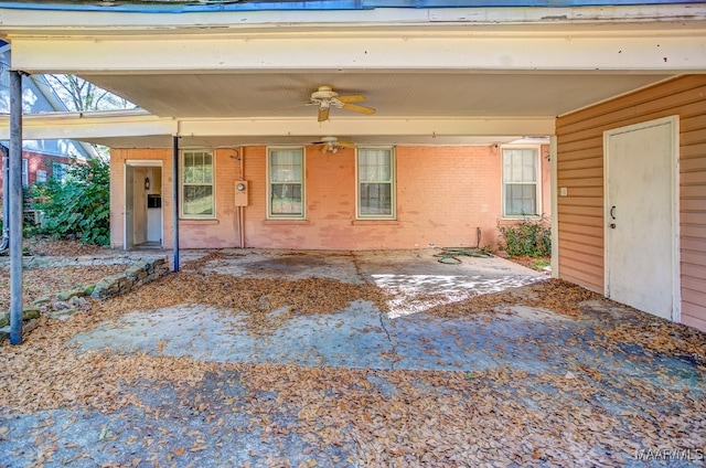 doorway to property featuring ceiling fan and a patio