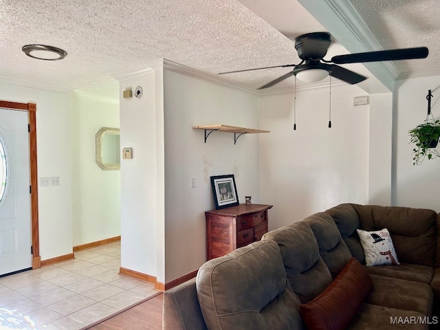 living room featuring a textured ceiling, ceiling fan, and crown molding