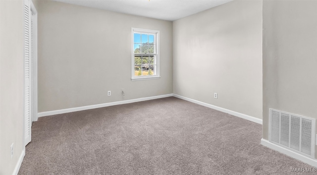 unfurnished room with carpet