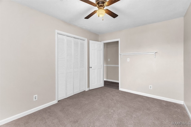 unfurnished bedroom featuring ceiling fan, carpet floors, and a closet