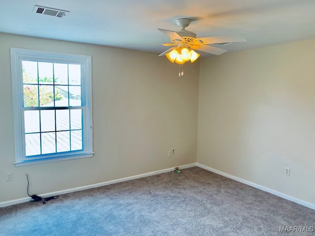 unfurnished room with ceiling fan and carpet floors