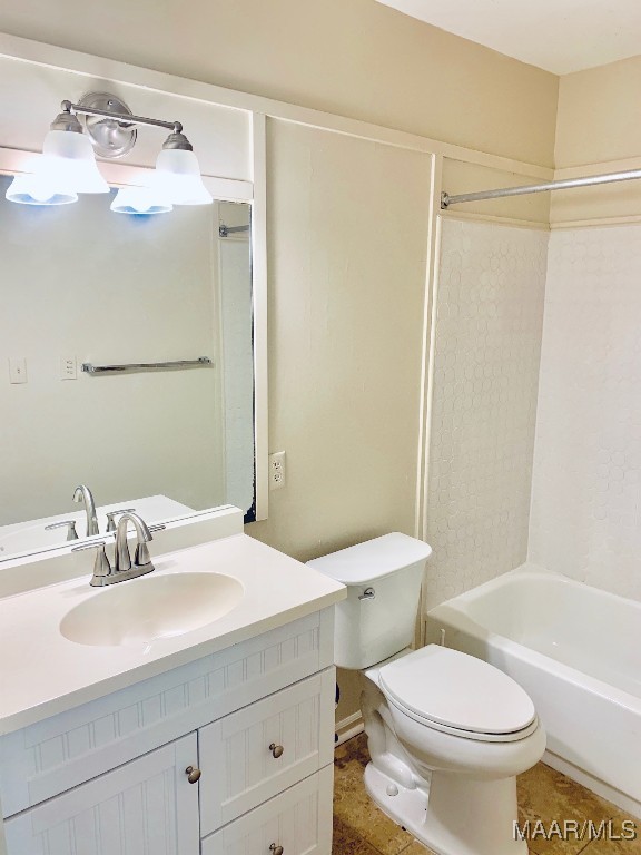 full bathroom with tile patterned floors, vanity, toilet, and bathing tub / shower combination