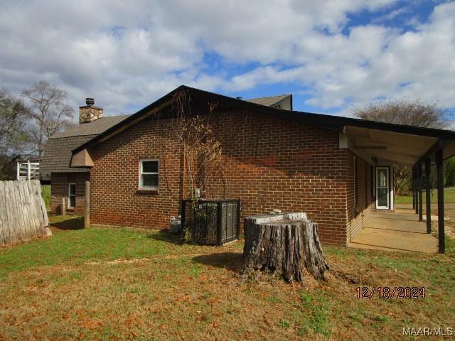 view of home's exterior with a yard