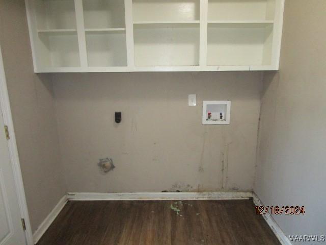 washroom with hookup for an electric dryer, washer hookup, and dark hardwood / wood-style flooring