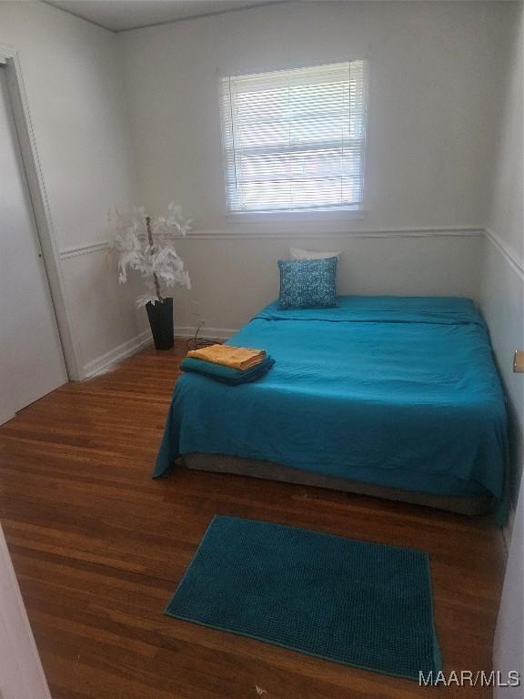 bedroom featuring dark hardwood / wood-style floors