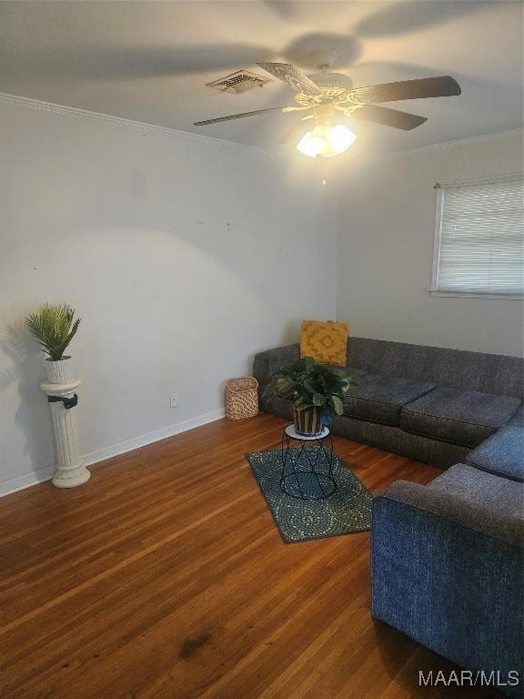 living room featuring ceiling fan and dark wood-type flooring