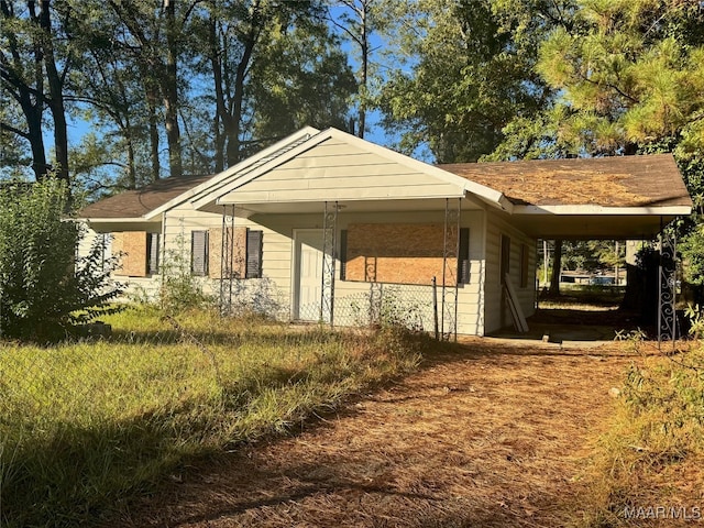 exterior space featuring a carport