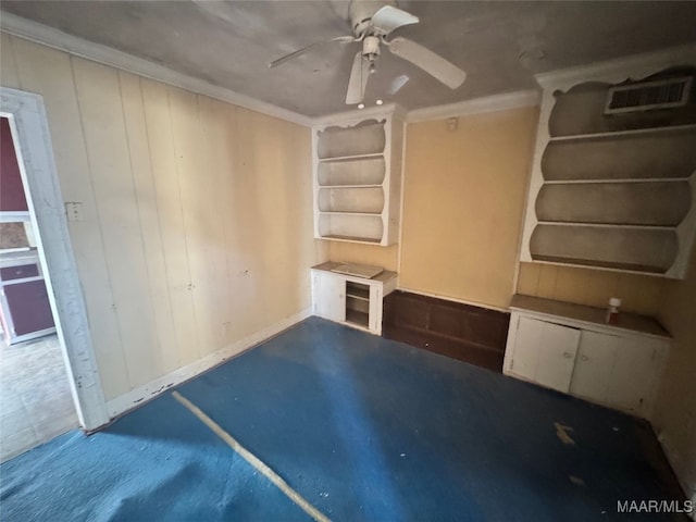 interior space with ceiling fan, built in features, and ornamental molding