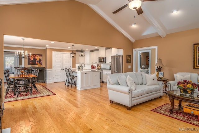 living room featuring ceiling fan with notable chandelier, crown molding, high vaulted ceiling, beamed ceiling, and light hardwood / wood-style floors