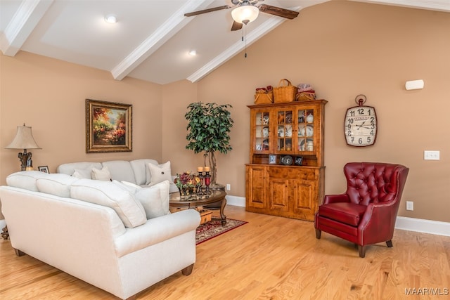 living room featuring lofted ceiling with beams, ceiling fan, and light hardwood / wood-style floors