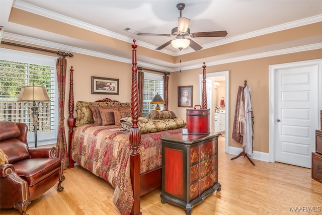 bedroom with ceiling fan, light wood-type flooring, crown molding, and multiple windows