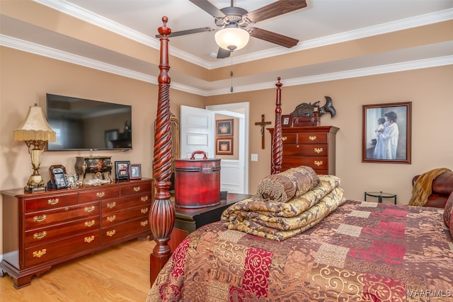 bedroom with ceiling fan, crown molding, and light hardwood / wood-style floors