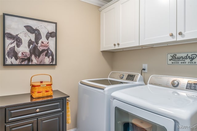 laundry area featuring cabinets, independent washer and dryer, and ornamental molding