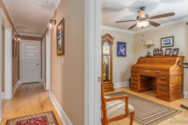 hall featuring hardwood / wood-style floors and ornamental molding