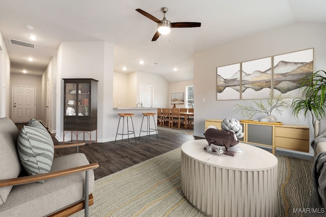 living room featuring dark hardwood / wood-style flooring, ceiling fan, lofted ceiling, and sink