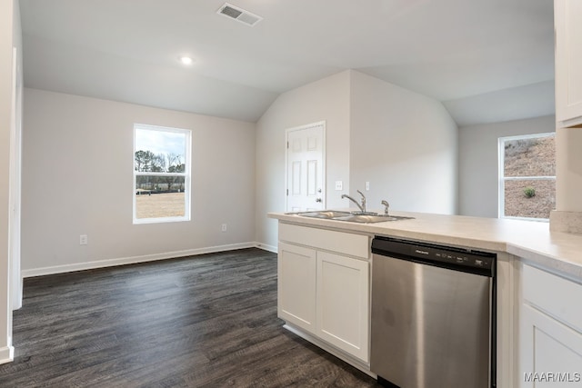 kitchen featuring sink, white cabinets, stainless steel dishwasher, and vaulted ceiling